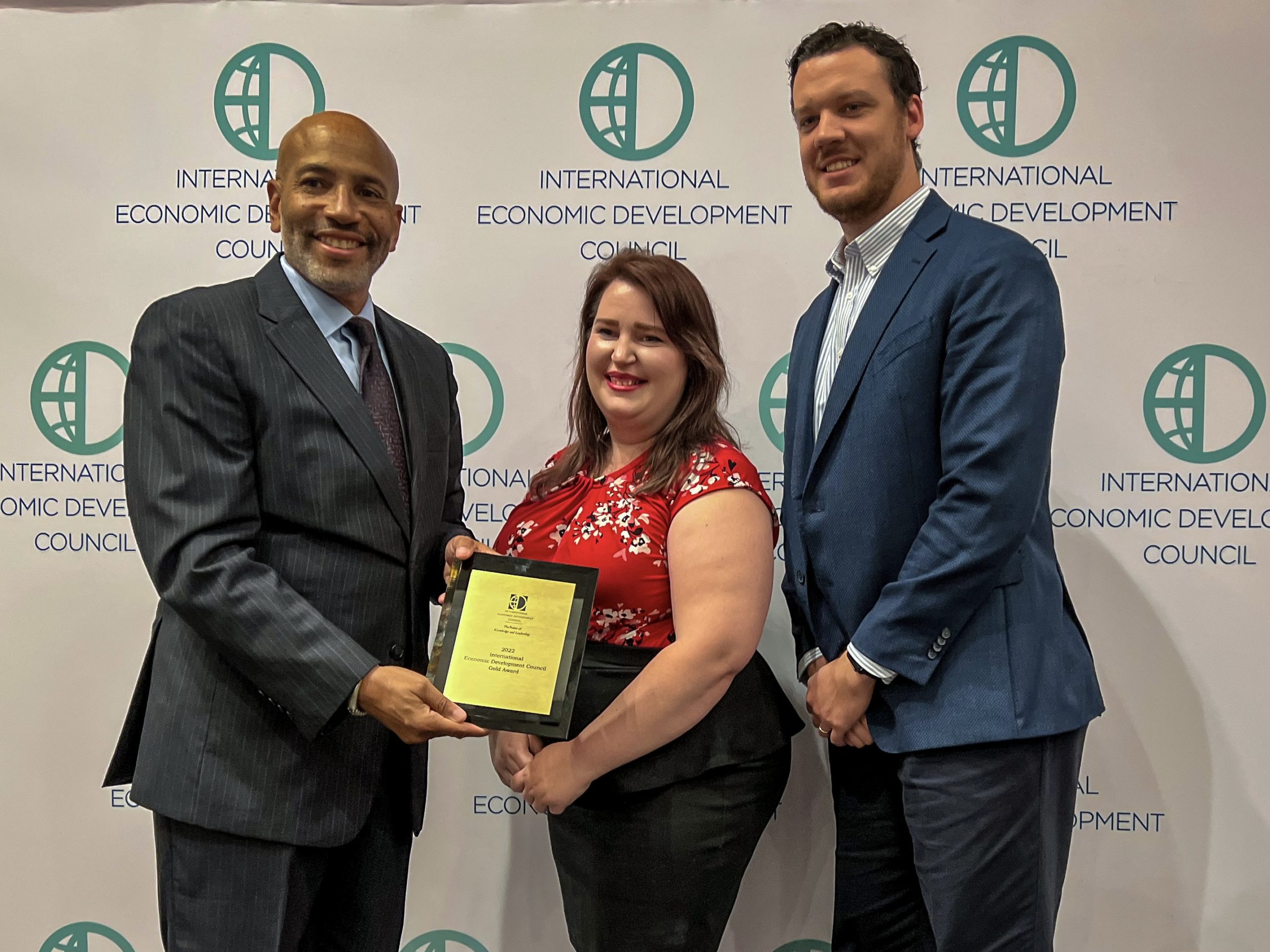Workforce development director and business development officer accept the award