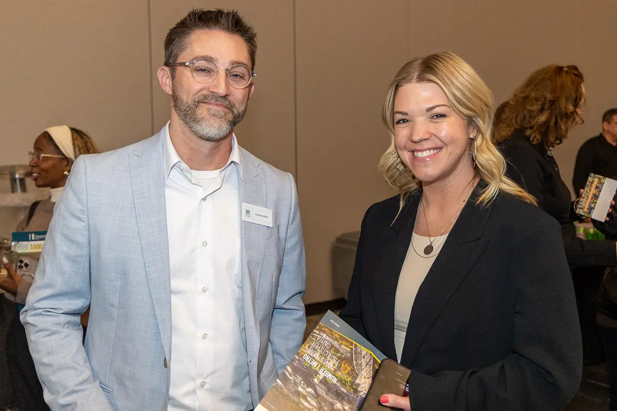 invited guest stand visiting at the 2026 annual meeting.