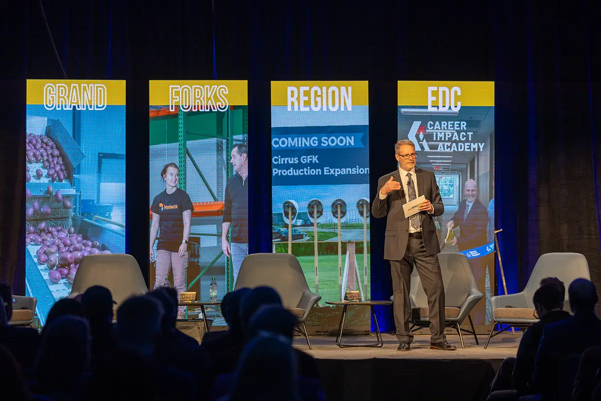 EDC president & CEO keith lund stands center stage delivering remarks at the 2026 annual meeting.
