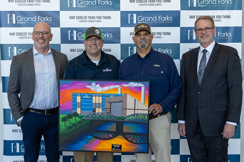 Kieth Lund and Shawn Gaddie presenting Simplot with the Klaus Thiessen Impact Award at the 2026 Annual Meeting.