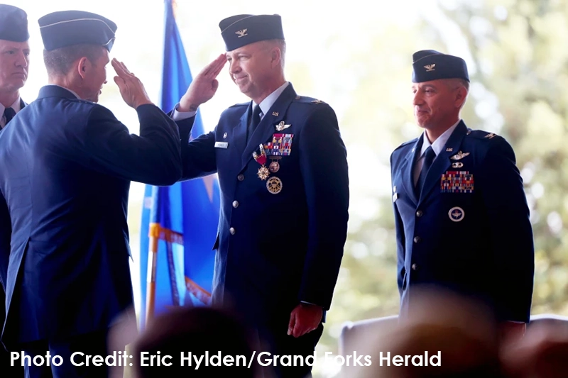 Col. Timothy Monroe, center, salutes Lt. Gen. Thomas Hensley at Tuesday's Change of Command Ceremony at the Grand Forks Air Force Base.